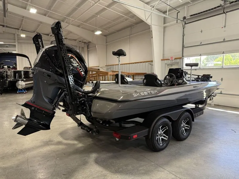 Slide: The Image of 2025 Skeeter ZXR20 boat in a garage, showcasing sleek design and powerful engine. - 2