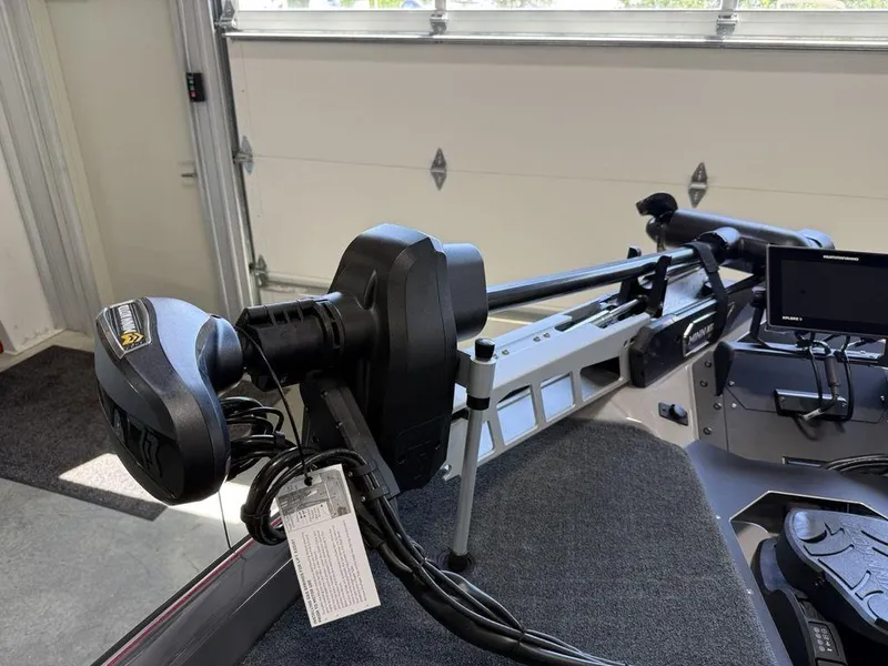 Slide: The Image of 2025 Skeeter ZXR20 boat with advanced trolling motor and navigation system in a garage. - 7