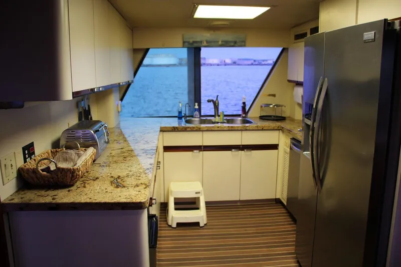 Slide: The Image of Kitchen interior of 1985 Hatteras 72 Motor Yacht with ocean view through window. - 18