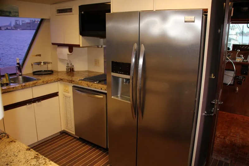 Slide: The Image of Kitchen interior of 1985 Hatteras 72 Motor Yacht with stainless steel appliances. - 20