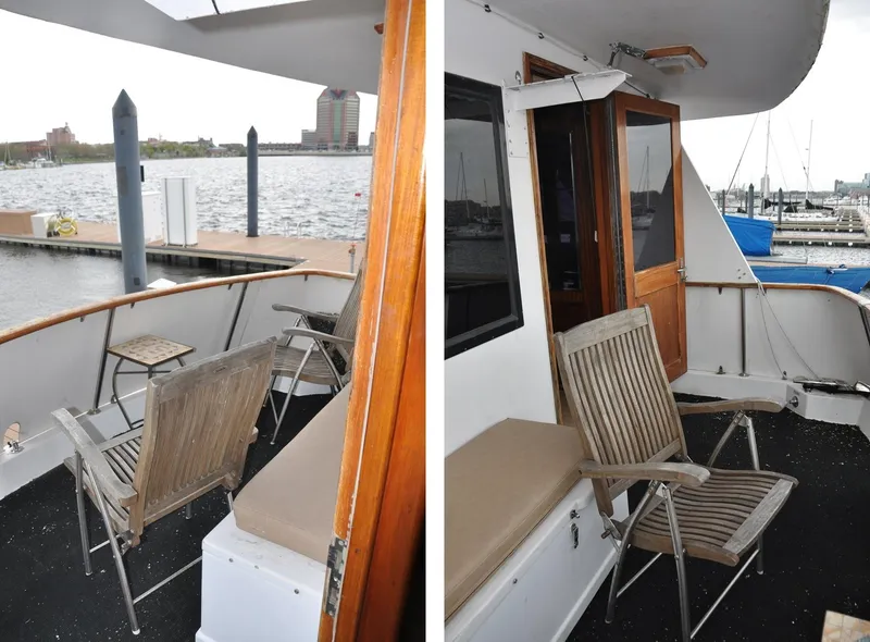Slide: The Image of 1985 Hatteras 72 Motor Yacht deck with wooden chairs and marina view. - 31