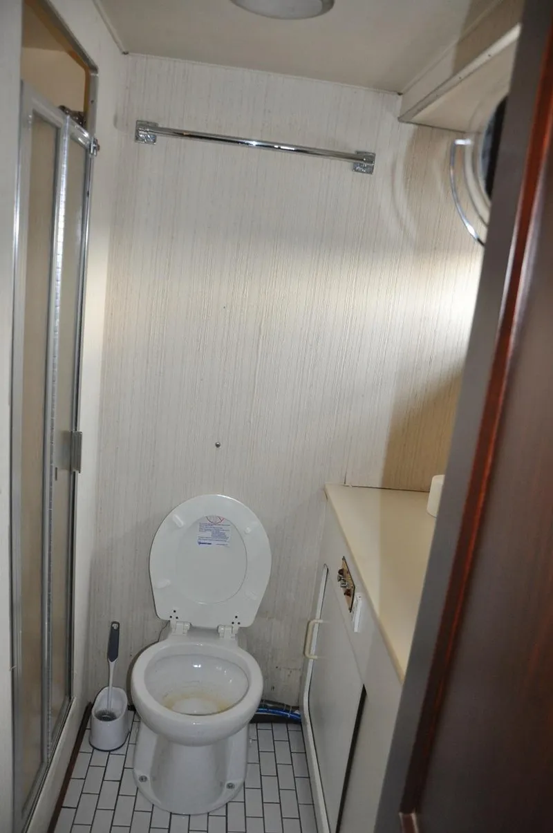 Slide: The Image of Bathroom interior of 1985 Hatteras 72 Motor Yacht with shower and toilet. - 36