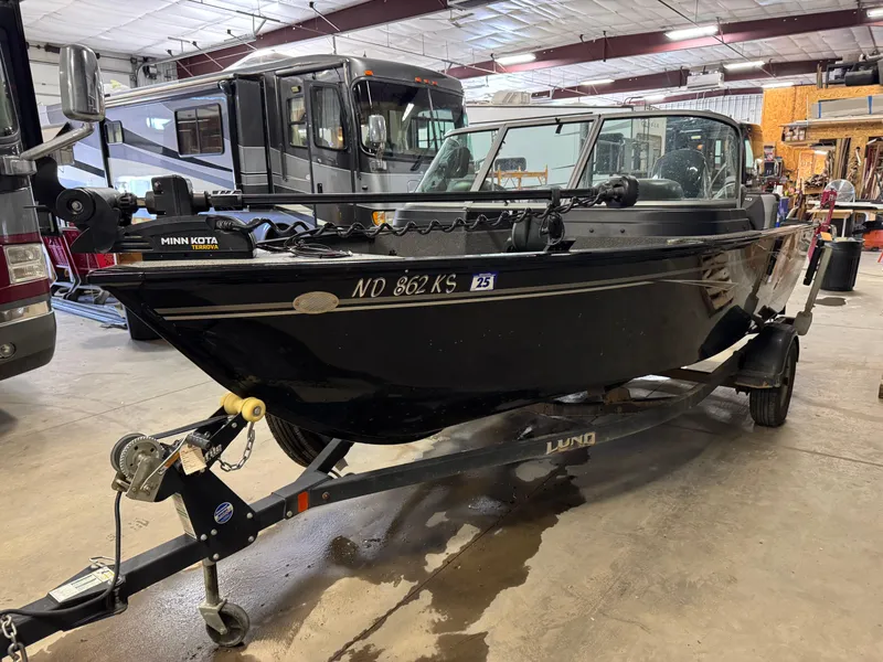 Slide: The Image of 2019 Lund 1675 Adventure Sport boat on trailer in indoor storage. - 1