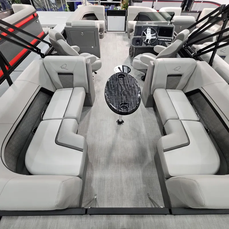Slide: The Image of 2025 Qwest L 22RLS boat interior with plush seating and sleek design. - 10