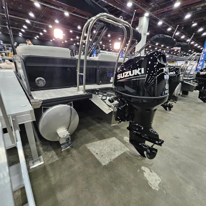 Slide: The Image of 2025 Qwest L 22RLS pontoon boat with Suzuki outboard motor at indoor exhibition. - 13