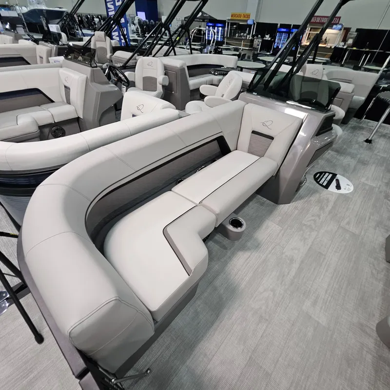 Slide: The Image of Luxurious interior of 2025 Qwest L 22RLS pontoon boat with plush seating. - 4