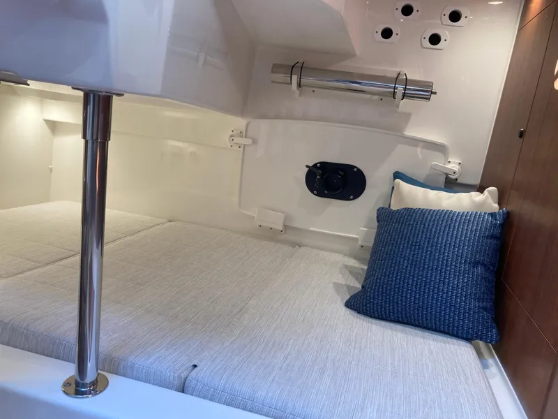 Slide: The Image of 2025 Pursuit OS 325 cabin interior with cozy bedding and modern design. - 30