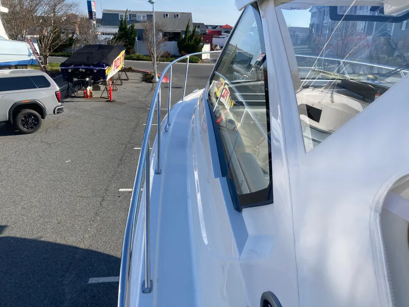Slide: The Image of 2025 Pursuit OS 325 boat on display in a parking lot. - 37