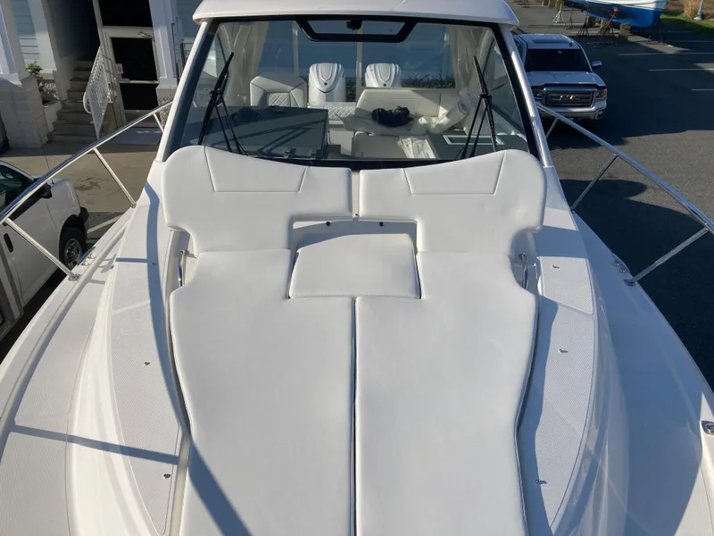 Slide: The Image of 2025 Pursuit OS 325 boat with spacious deck and sleek design. - 40