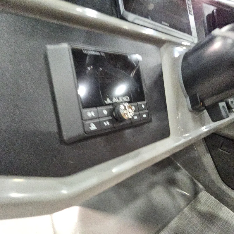 Slide: The Image of 2025 Qwest L18 Lanai dashboard with JL Audio system. - 12