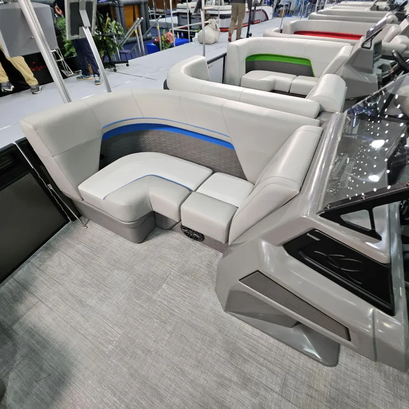 Slide: The Image of 2025 Qwest L18 Lanai boat interior with modern seating and sleek design. - 18