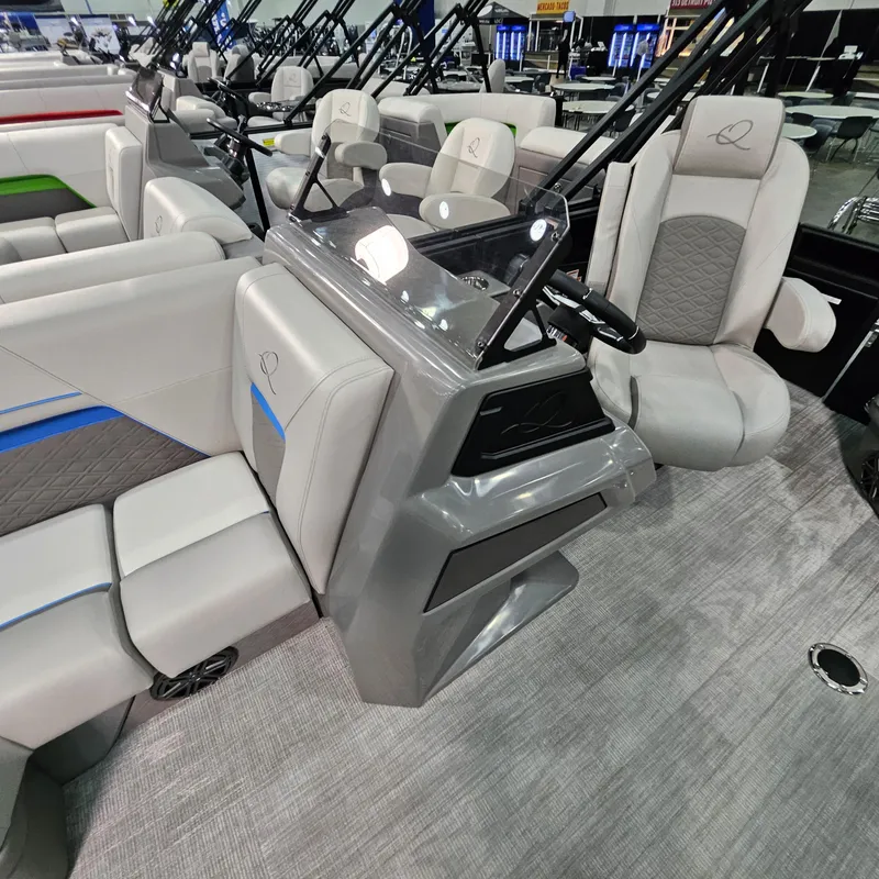 Slide: The Image of 2025 Qwest L18 Lanai boat interior with modern seating and sleek design. - 19