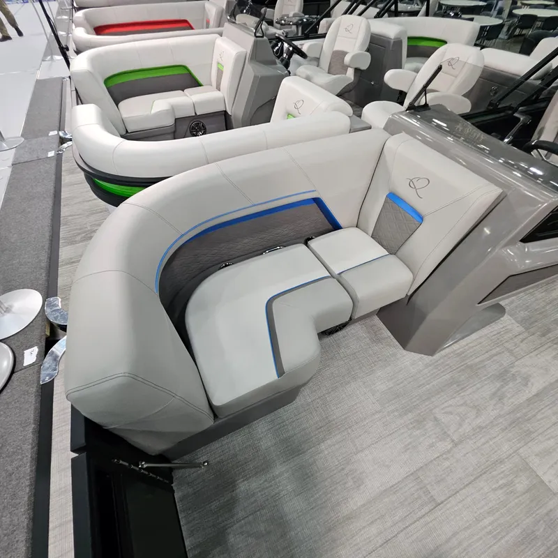 Slide: The Image of 2025 Qwest L18 Lanai boat interior with modern seating and sleek design. - 24