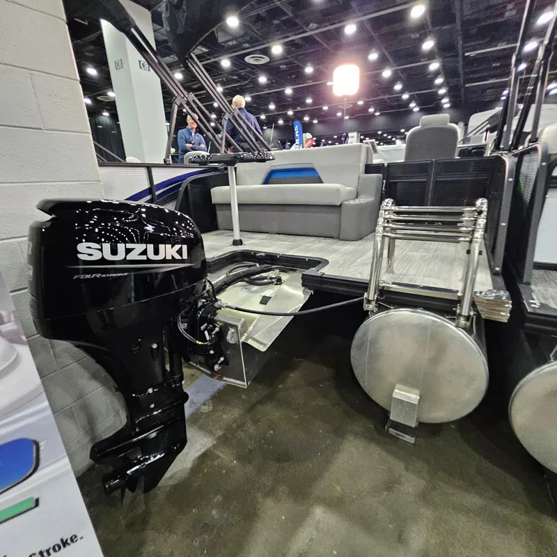 Slide: The Image of 2025 Qwest L18 Lanai boat with Suzuki outboard motor at indoor exhibition. - 3
