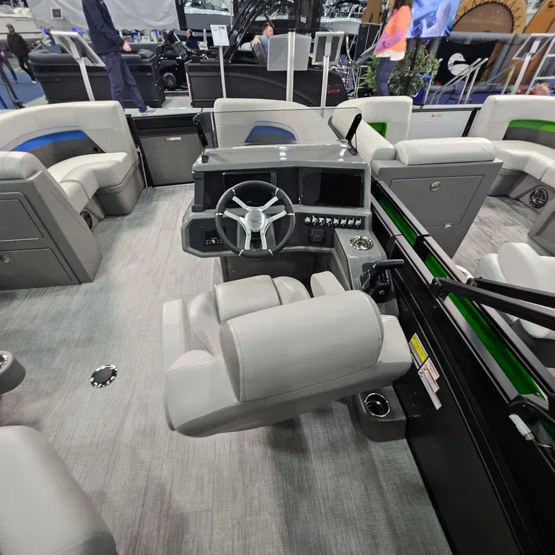 Slide: The Image of 2025 Qwest L18 Lanai boat interior with modern helm and seating arrangement. - 5
