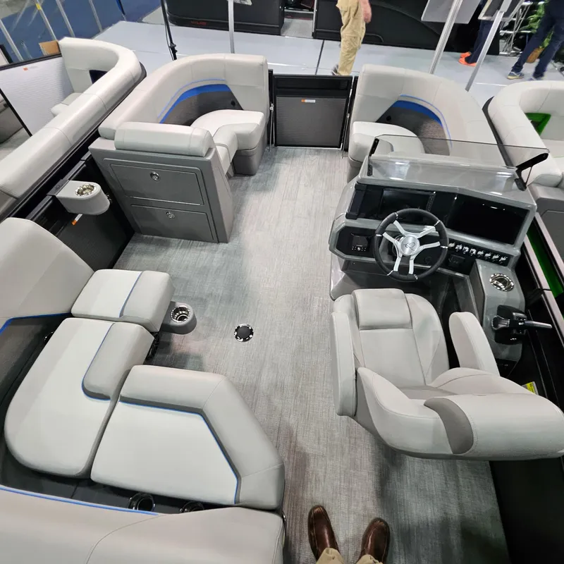 Slide: The Image of Interior of 2025 Qwest L18 Lanai pontoon boat with modern seating and steering console. - 8