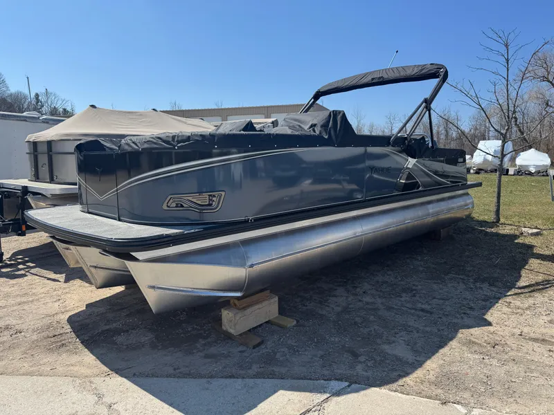 Slide: The Image of 2025 Tahoe Pontoon LTZ Versatile Rear Bench Windshield on display outdoors. - 0