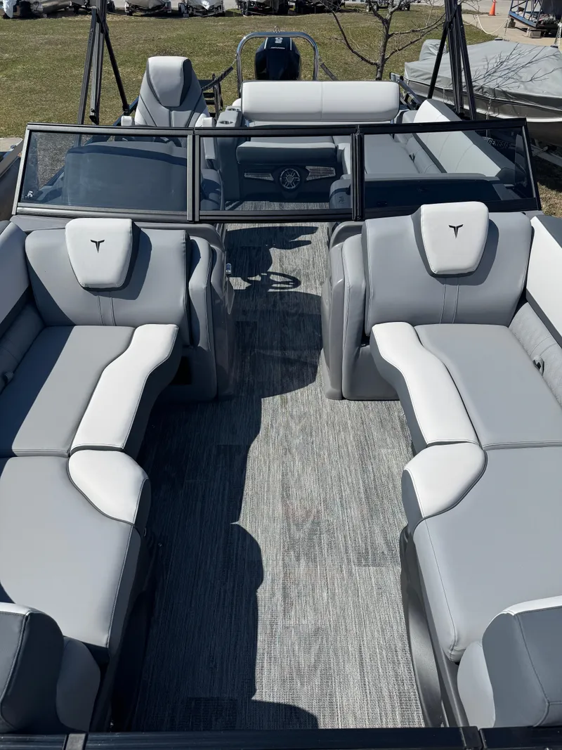 Slide: The Image of 2025 Tahoe Pontoon LTZ Versatile Rear Bench Windshield with spacious seating and modern design. - 12