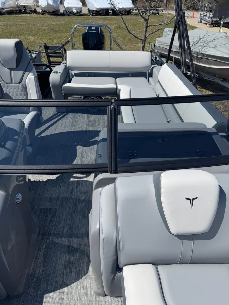 Slide: The Image of 2025 Tahoe Pontoon LTZ Versatile Rear Bench Windshield with sleek seating and modern design. - 13