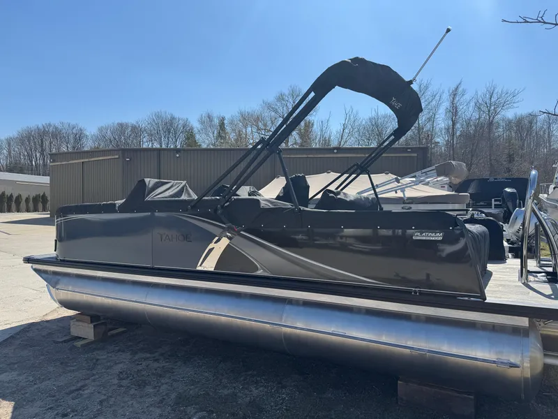 Slide: The Image of 2025 Tahoe Pontoon LTZ Versatile Rear Bench Windshield on display outdoors. - 4