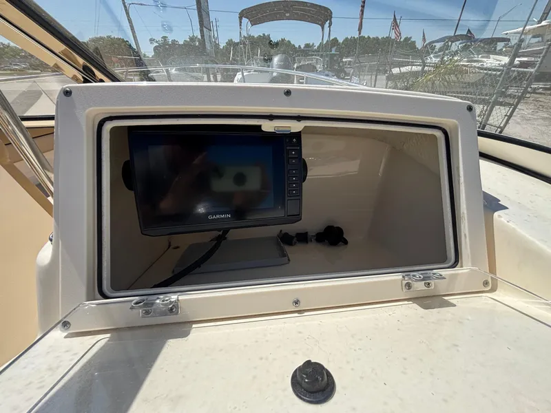 Slide: The Image of 2018 Scout 210 Dorado boat dashboard with Garmin navigation system. - 29