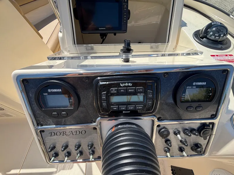 Slide: The Image of Control panel of a 2018 Scout 210 Dorado boat with Yamaha gauges and Infinity audio system. - 30
