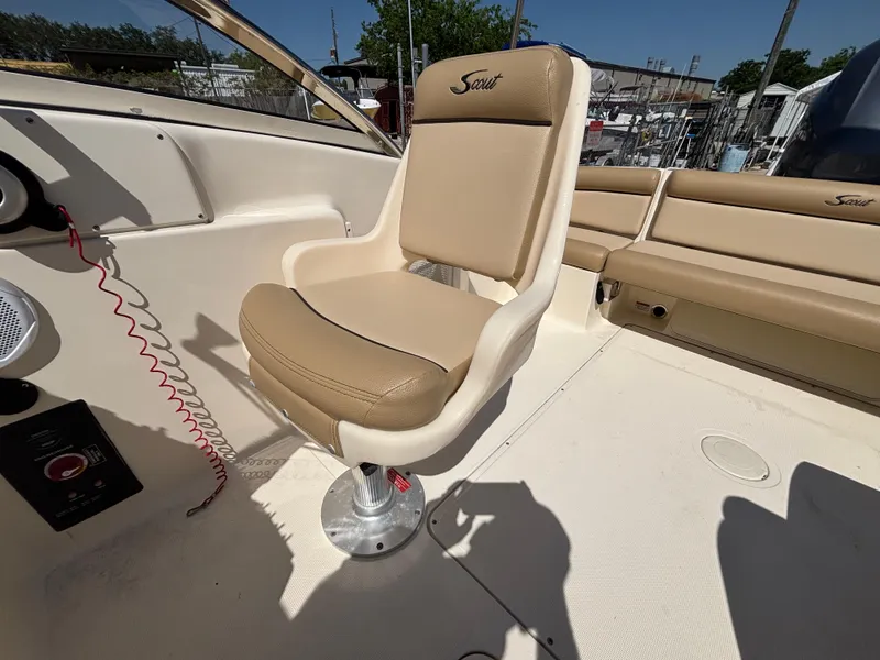 Slide: The Image of Captain's chair on 2018 Scout 210 Dorado boat, beige upholstery, sunny day. - 32