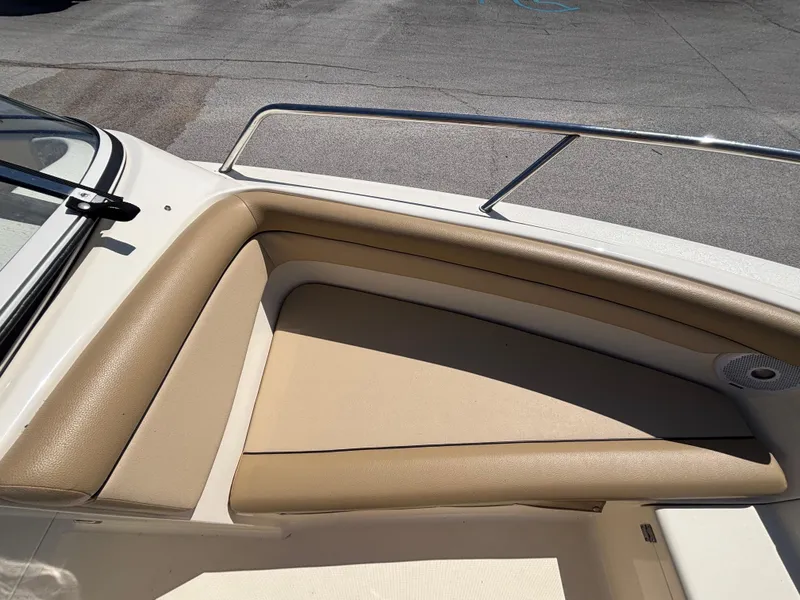 Slide: The Image of 2018 Scout 210 Dorado boat with tan seating and stainless steel railing. - 40