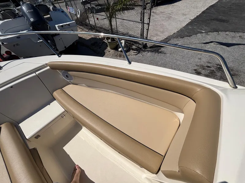 Slide: The Image of 2018 Scout 210 Dorado boat interior with tan seating and stainless steel railing. - 41