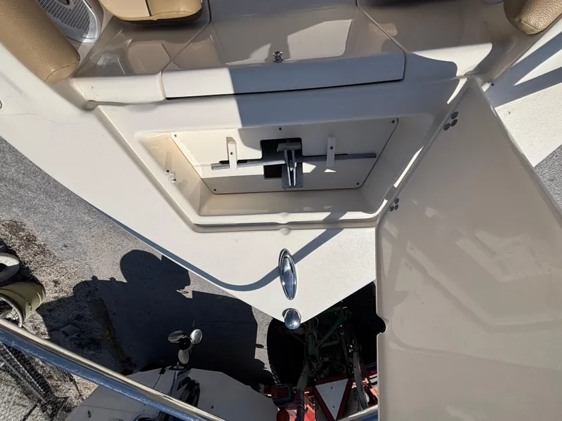 Slide: The Image of 2018 Scout 210 Dorado boat interior with open storage compartment. - 45
