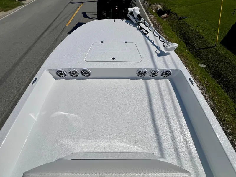Slide: The Image of 2025 SCB S22 boat deck with speakers and trolling motor on a road. - 10
