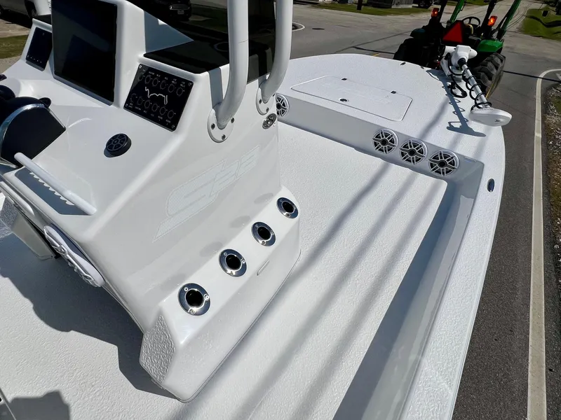 Slide: The Image of 2025 SCB S22 boat console with electronics and speakers on a sunny day. - 11