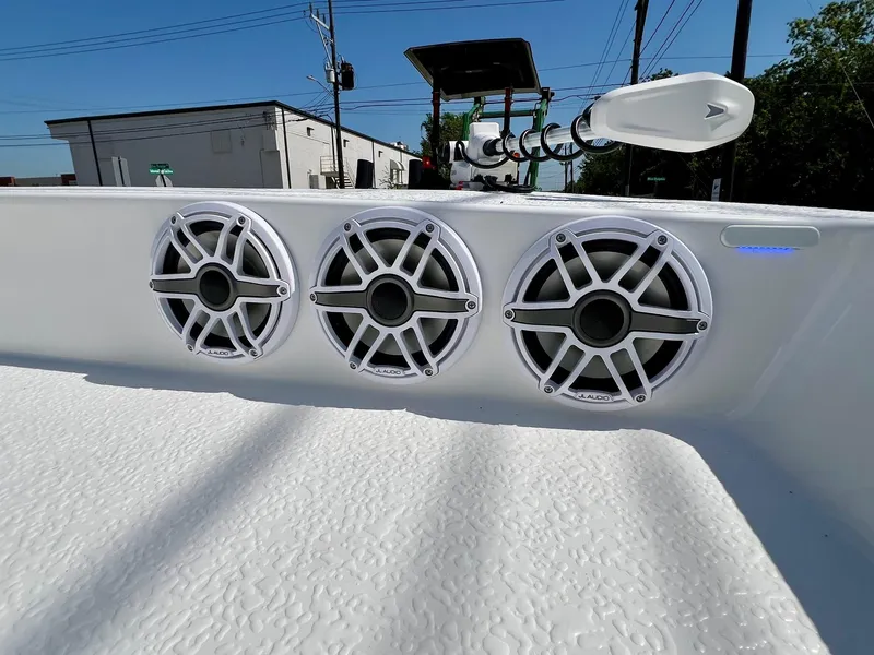 Slide: The Image of Three marine speakers on a 2025 SCB S22 boat, outdoor setting. - 15