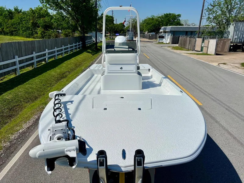 Slide: The Image of 2025 SCB S22 boat on trailer, parked on a suburban street. - 6