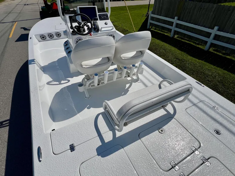 Slide: The Image of 2025 SCB S22 boat interior with dual seats and steering console. - 8