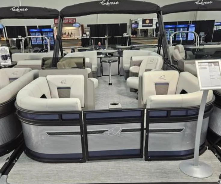 Slide: The Image of 2025 Qwest E 20RLS pontoon boat with luxurious seating and modern design. - 1