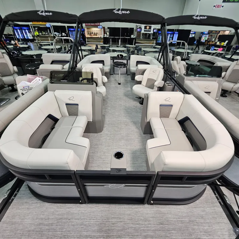 Slide: The Image of 2025 Qwest E 20RLS pontoon boat with spacious seating and modern design. - 13