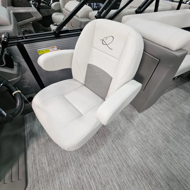 Slide: The Image of Luxurious white captain's chair in 2025 Qwest E 20RLS boat interior. - 18