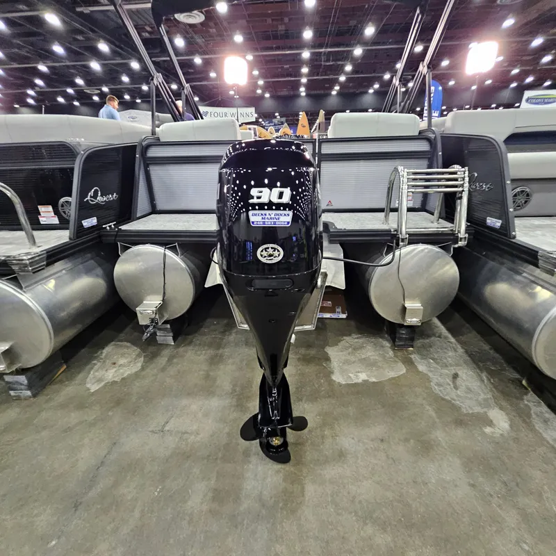 Slide: The Image of 2025 Qwest E 20RLS pontoon boat with 90 HP outboard motor at indoor exhibition. - 25