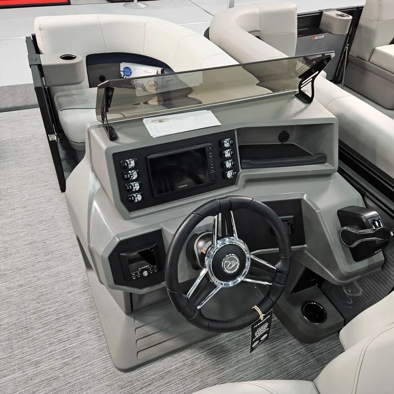 Slide: The Image of 2025 Qwest E 20RLS boat dashboard with steering wheel and control panel. - 4