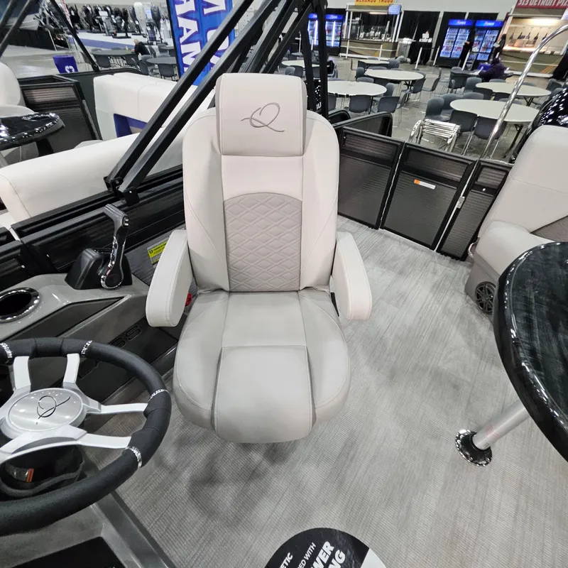 Slide: The Image of Captain's chair in a 2025 Qwest L22 Lanai boat, featuring a sleek, modern design. - 10