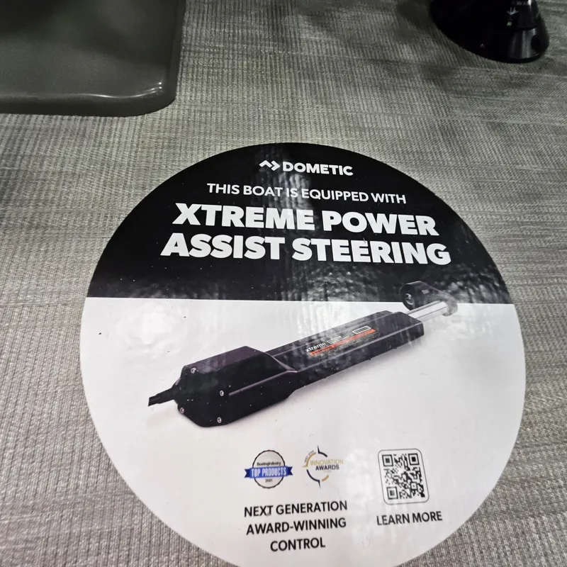Slide: The Image of 2025 Qwest L22 Lanai boat with Dometic Xtreme Power Assist Steering feature. - 11