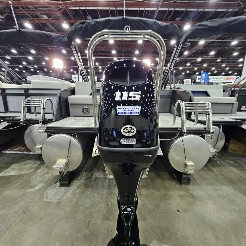 Slide: The Image of 2025 Qwest L22 Lanai pontoon boat with 115 horsepower engine displayed indoors. - 18