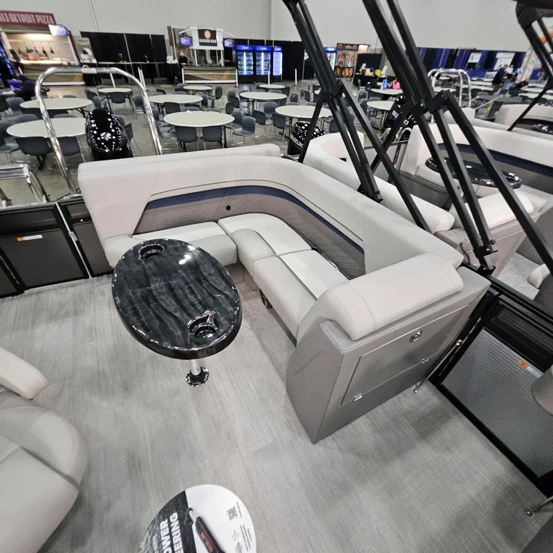 Slide: The Image of Luxurious seating area on 2025 Qwest L22 Lanai pontoon boat, featuring elegant design and modern amenities. - 7