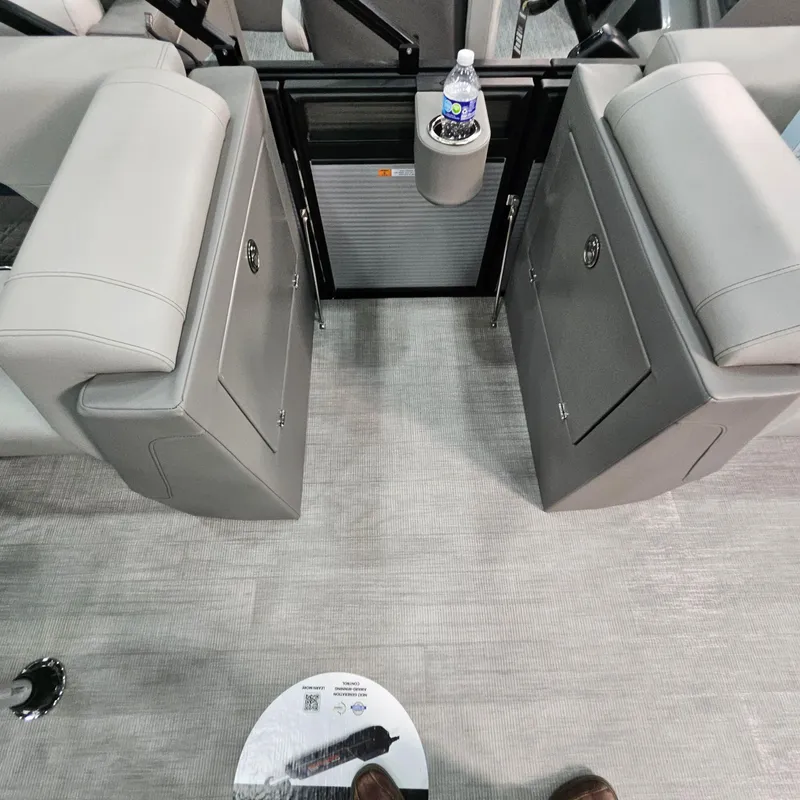 Slide: The Image of Interior of 2025 Qwest L22 Lanai boat with gray seating and cup holder. - 8