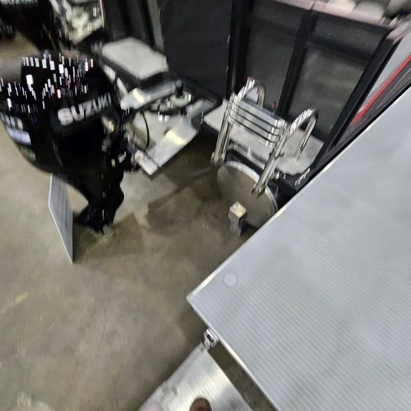 Slide: The Image of 2025 Qwest E 20XRE boat with Suzuki outboard motor and ladder. - 11