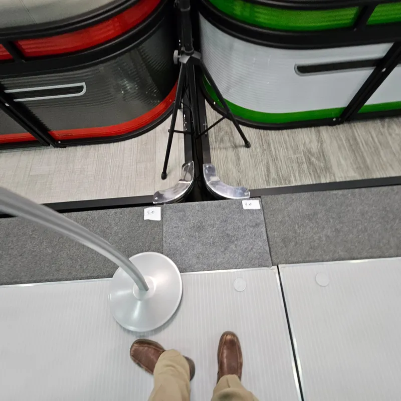 Slide: The Image of Man standing on a Qwest E 20XRE 2025 boat deck with colorful panels. - 17