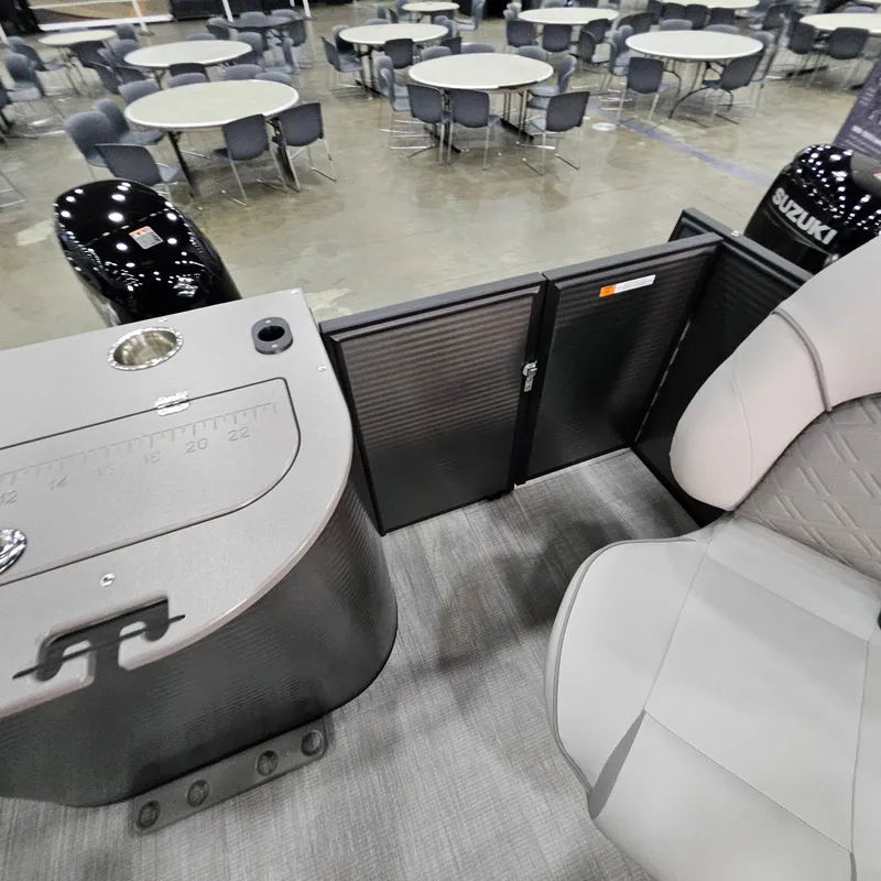Slide: The Image of Interior of 2025 Qwest E 20XRE boat with seating and control panel. - 27