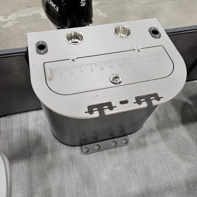 Slide: The Image of Qwest E 20XRE 2025 boat console with built-in cup holders and measuring scale. - 7