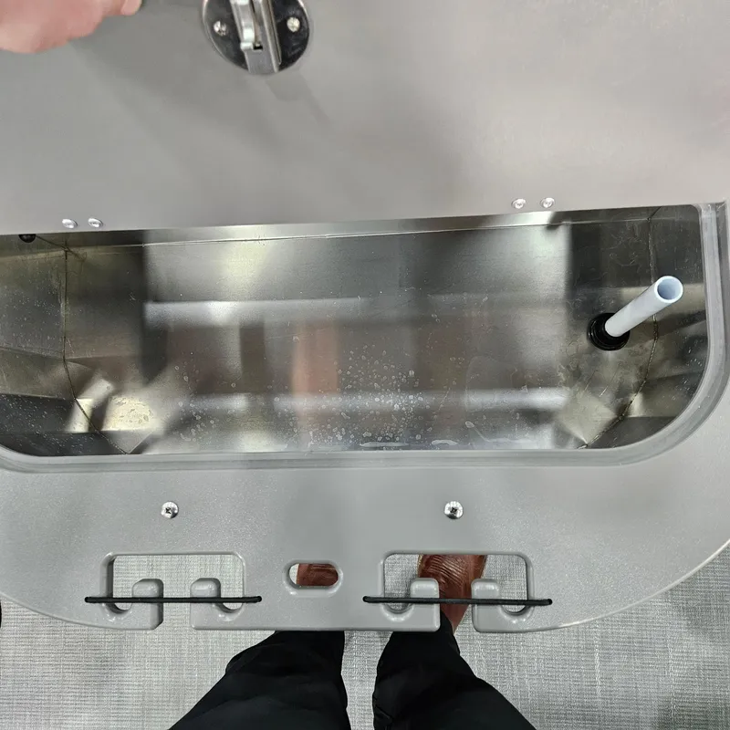 Slide: The Image of Interior view of a 2025 Qwest E 20XRE boat compartment with metallic finish. - 8